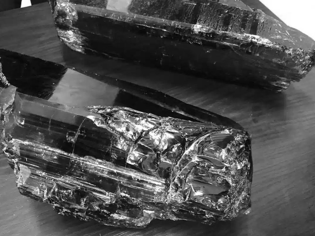 Graphite crystals beside a pencil