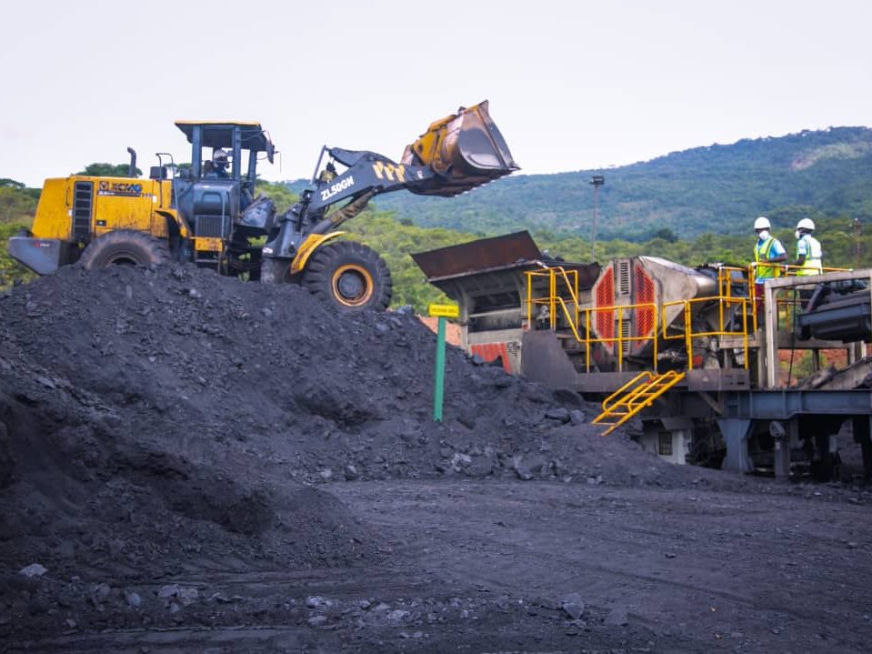 A wheel loader working an ore stockpile at a mine
